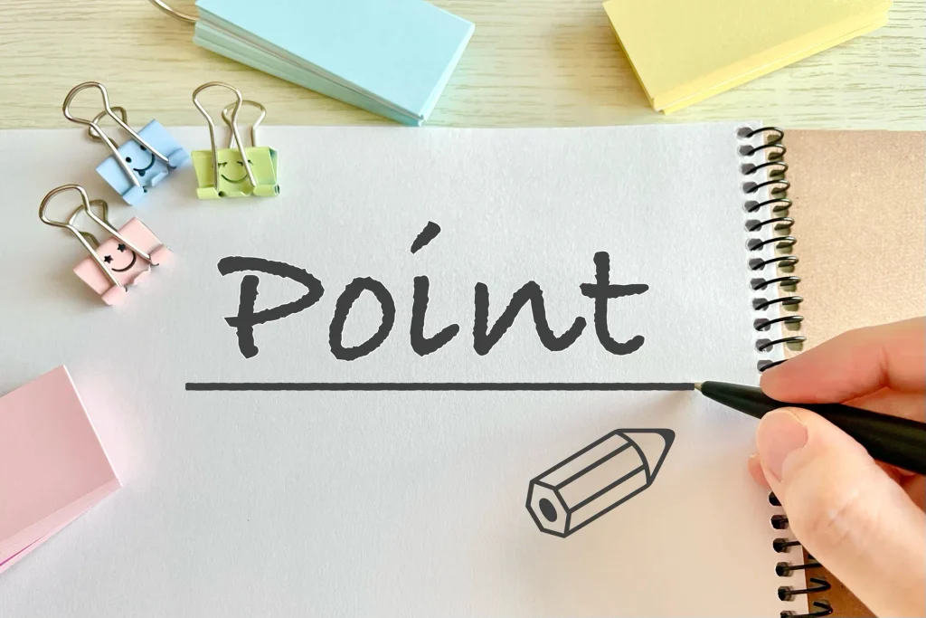 ノートに「Point」と書き込んでいる手元